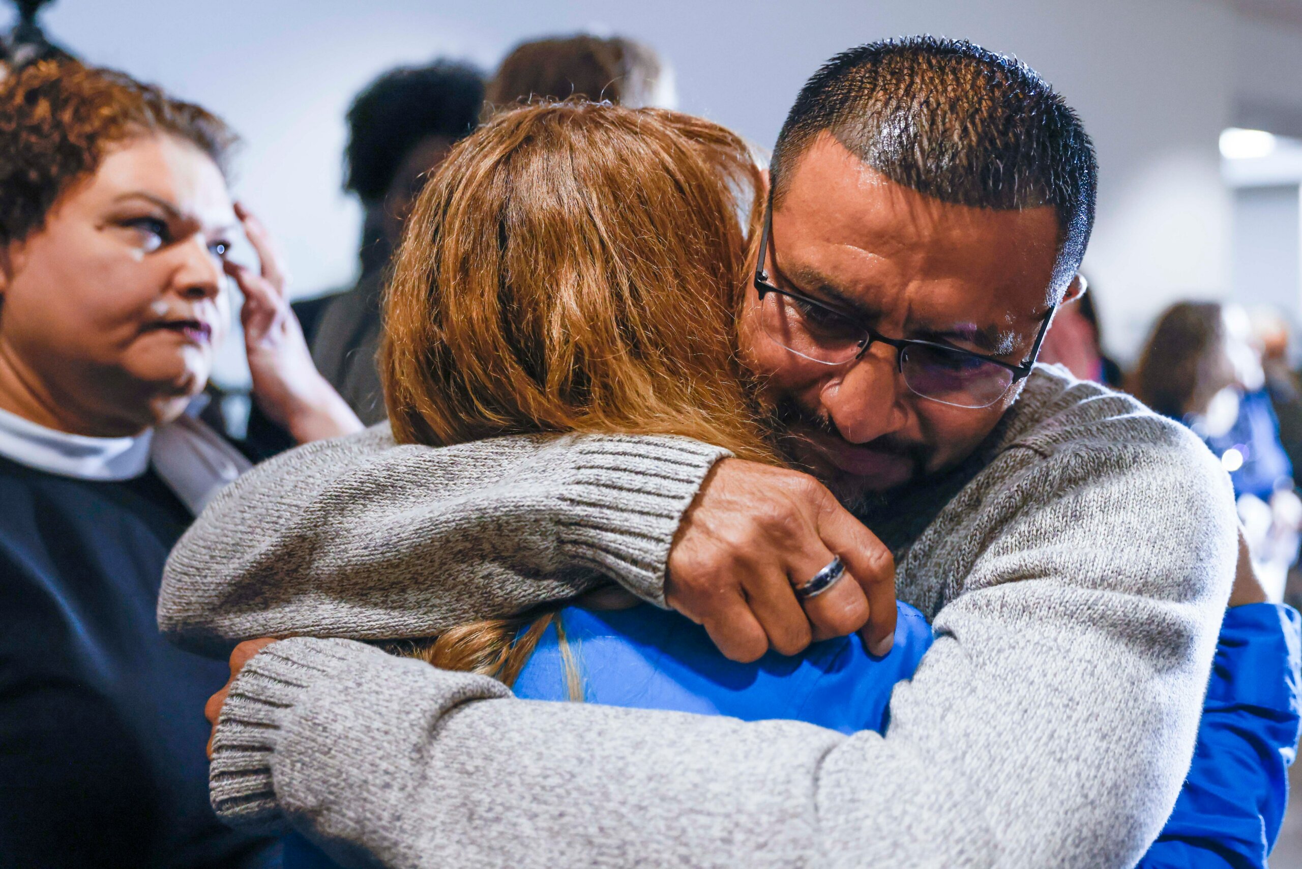 Martin Santillan embraces friend Angie Bell after his exoneration on March 22nd, 2023.